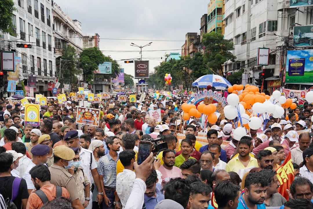 a large group of people standing in the middle of a street