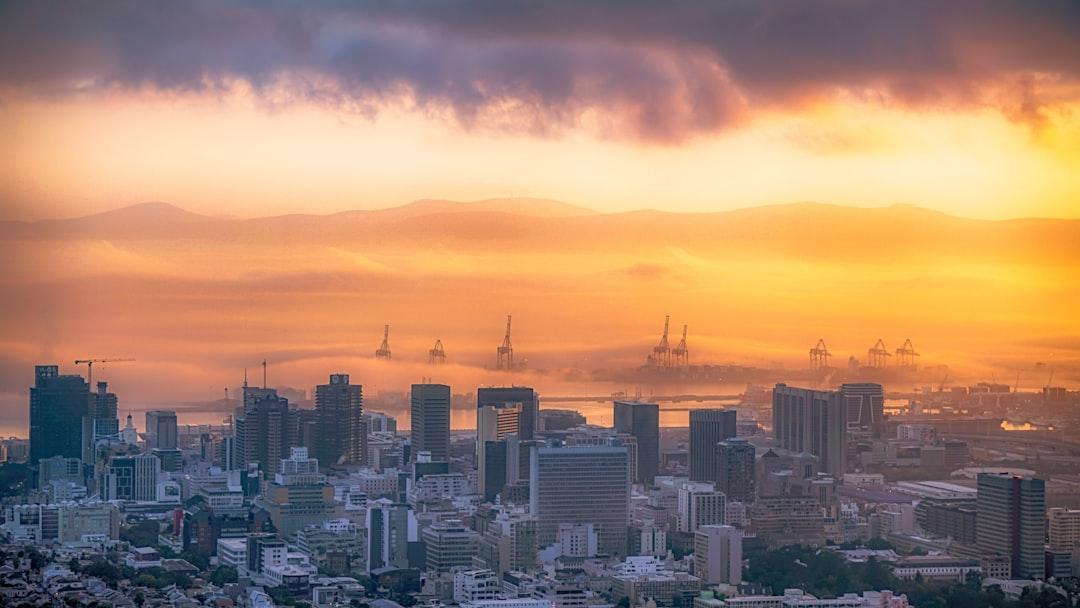 city skyline during orange sunset